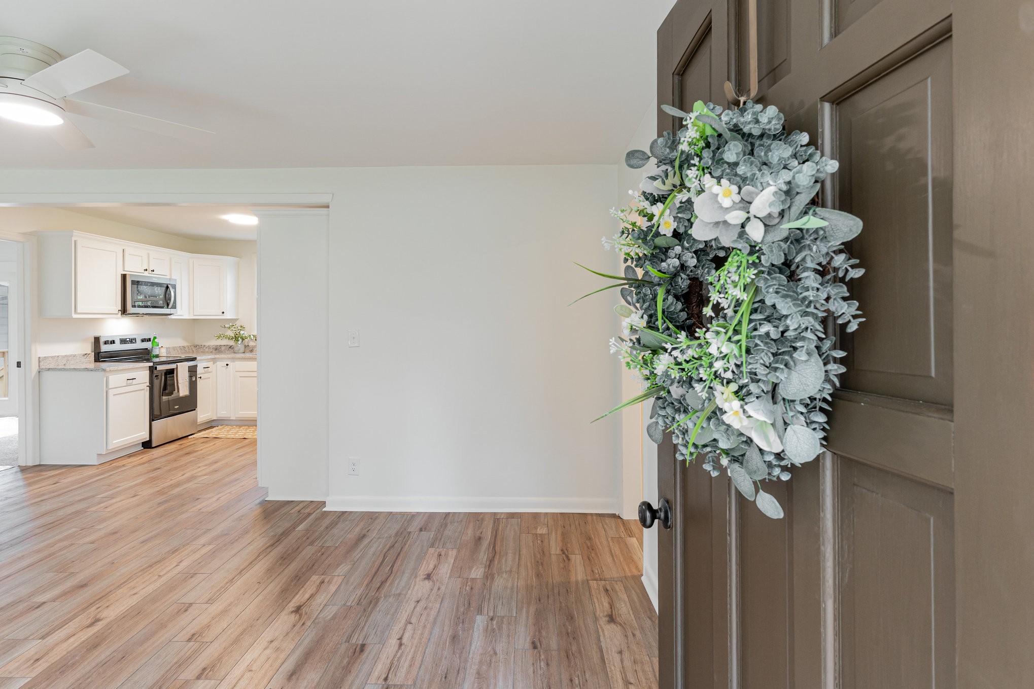 1307 Atlas Street Murfreesboro, TN 37130 - Photo 2 of 24 a view of a hallway with wooden floor and a potted plant