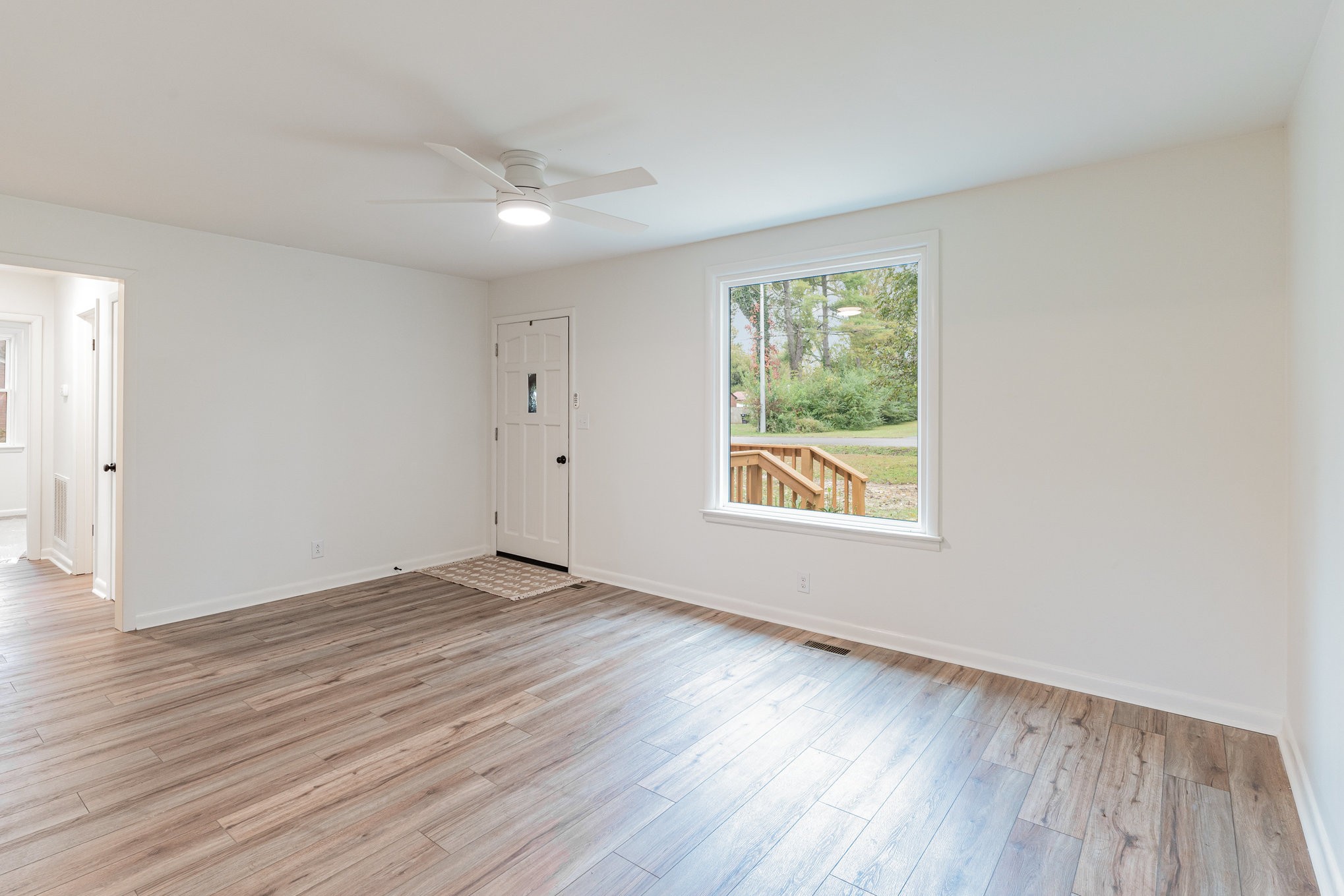 1307 Atlas Street Murfreesboro, TN 37130 - Photo 5 of 24 an empty room with wooden floor and windows