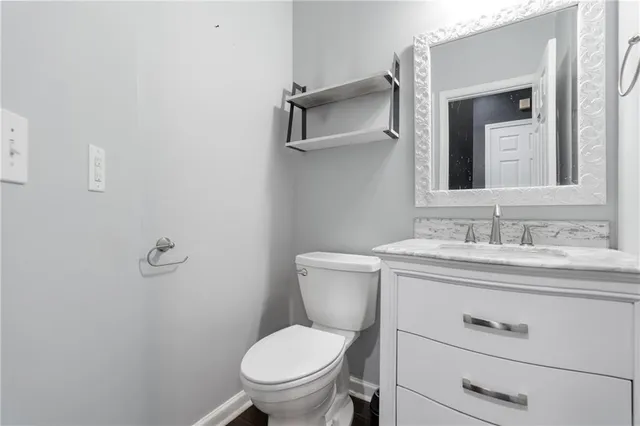 a kitchen with stainless steel appliances granite countertop a sink and a stove
