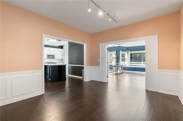 a view of entryway with wooden floor and staircase