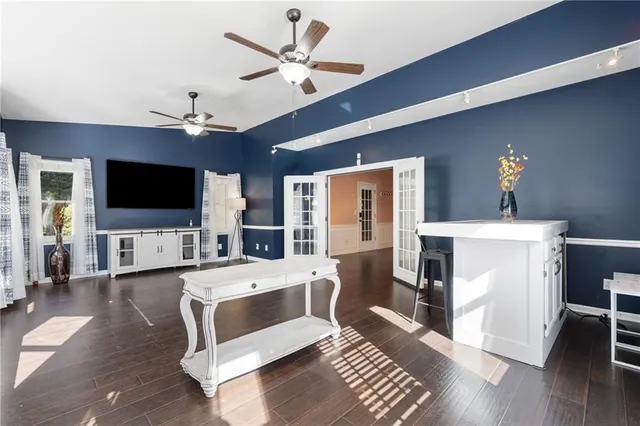 a kitchen with stainless steel appliances granite countertop a sink and a stove