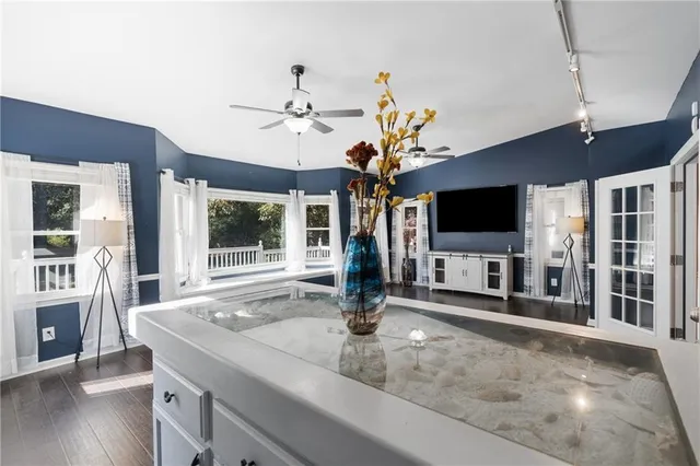 a view of entryway with wooden floor and staircase