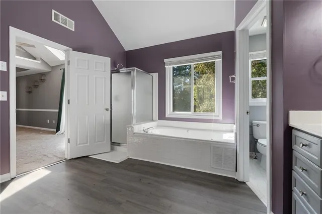 a white toilet sitting next to a window