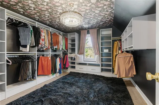 a living room with lots of furniture and storage