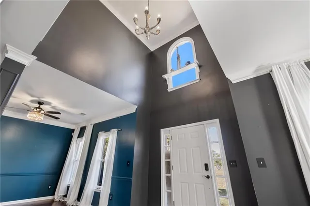 a view of an entryway with wooden floor