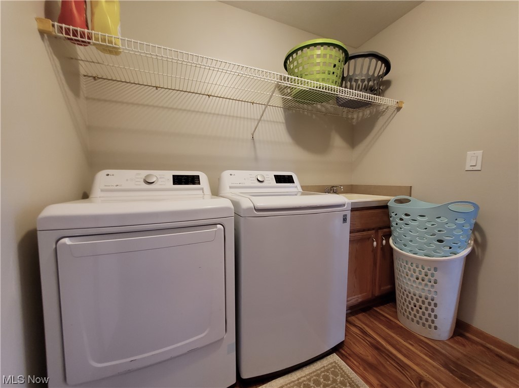 133 Matthew Drive Rittman, OH 44270 - Photo 27 of 35 Laundry room featuring washer and dryer and hardwood flooring