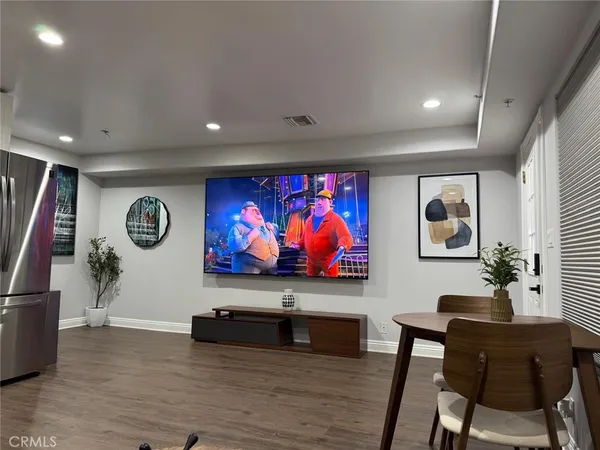 a view of room with furniture wooden floor and window