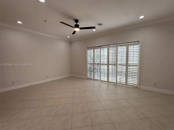 a view of an empty room with a window