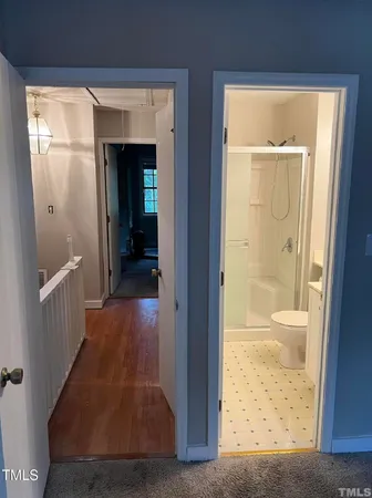 hallway with wooden floor and front door