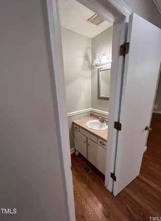 a bathroom with a sink and mirror