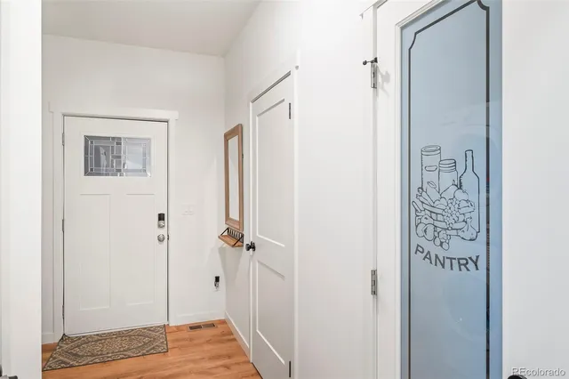 a view of a bathroom with a shower and a door