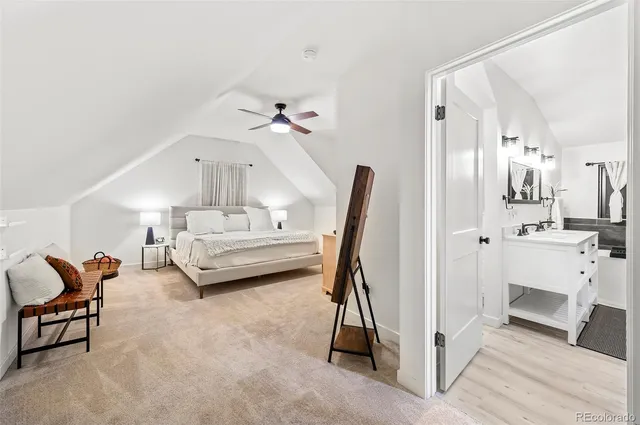 a bedroom with furniture and a ceiling fan