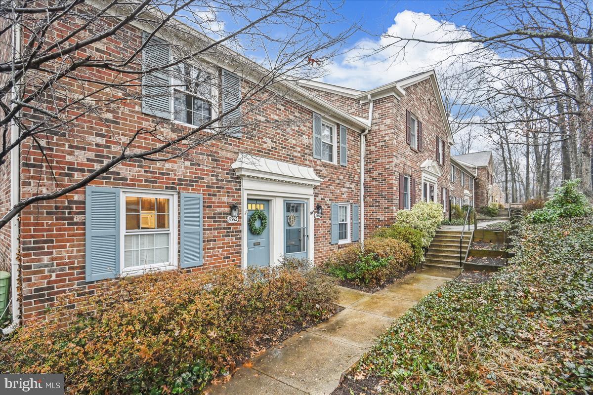 8352 Forrester Boulevard, Unit 456 Springfield, VA 22152 - Photo 1 of 18 a front view of a house with garden
