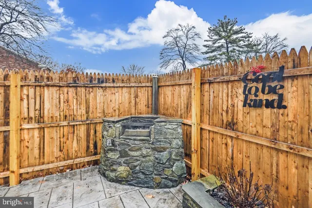 a view of outdoor space with wooden fence