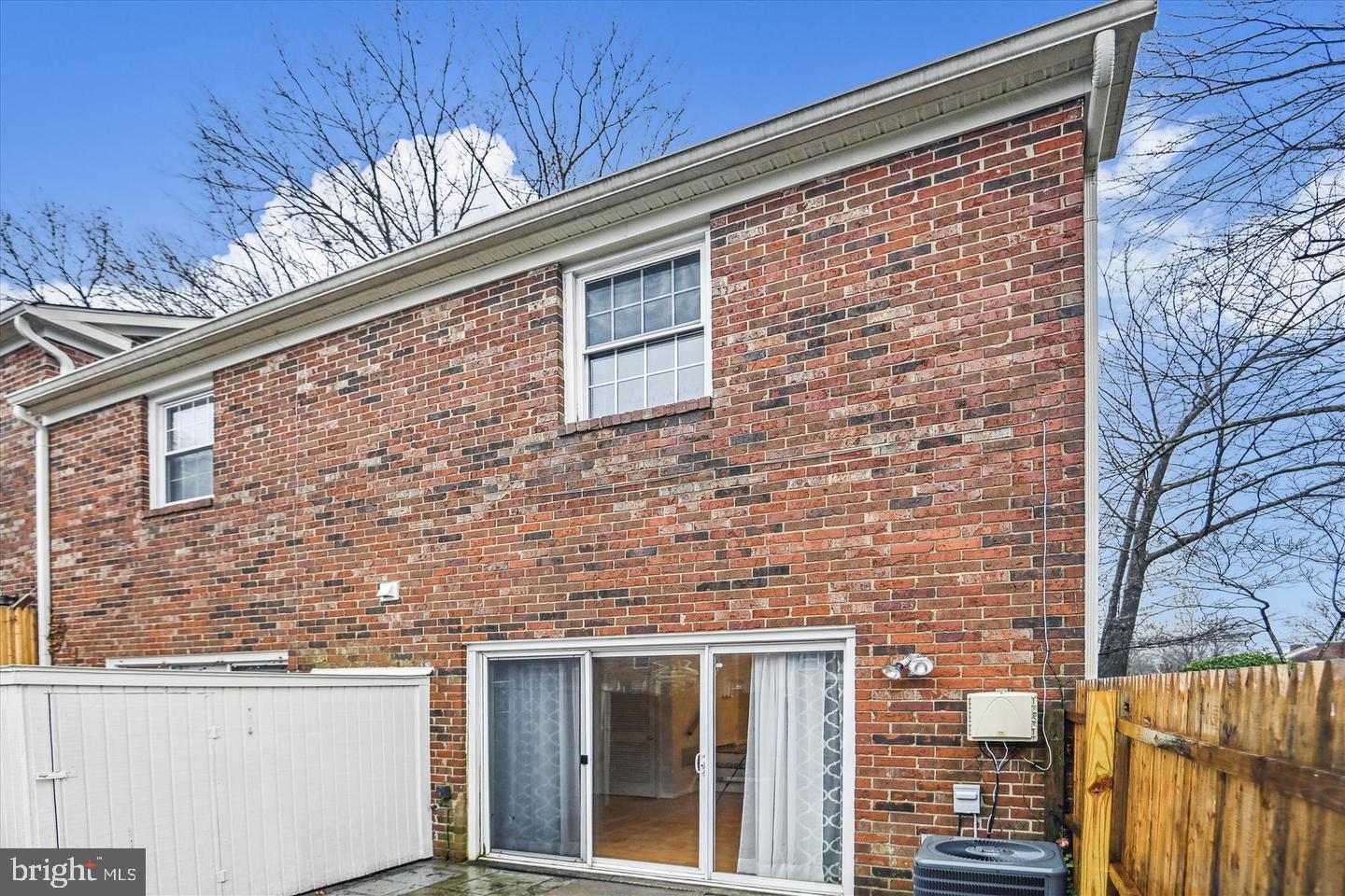 8352 Forrester Boulevard, Unit 456 Springfield, VA 22152 - Photo 14 of 18 a brick building with a large window