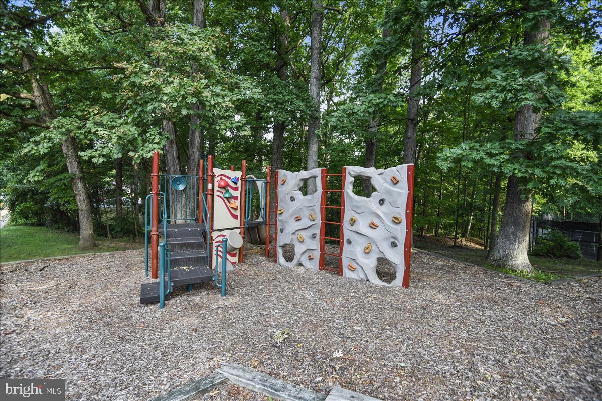 8352 Forrester Boulevard, Unit 456 Springfield, VA 22152 - Photo 15 of 18 a view of outdoor space with wooden fence