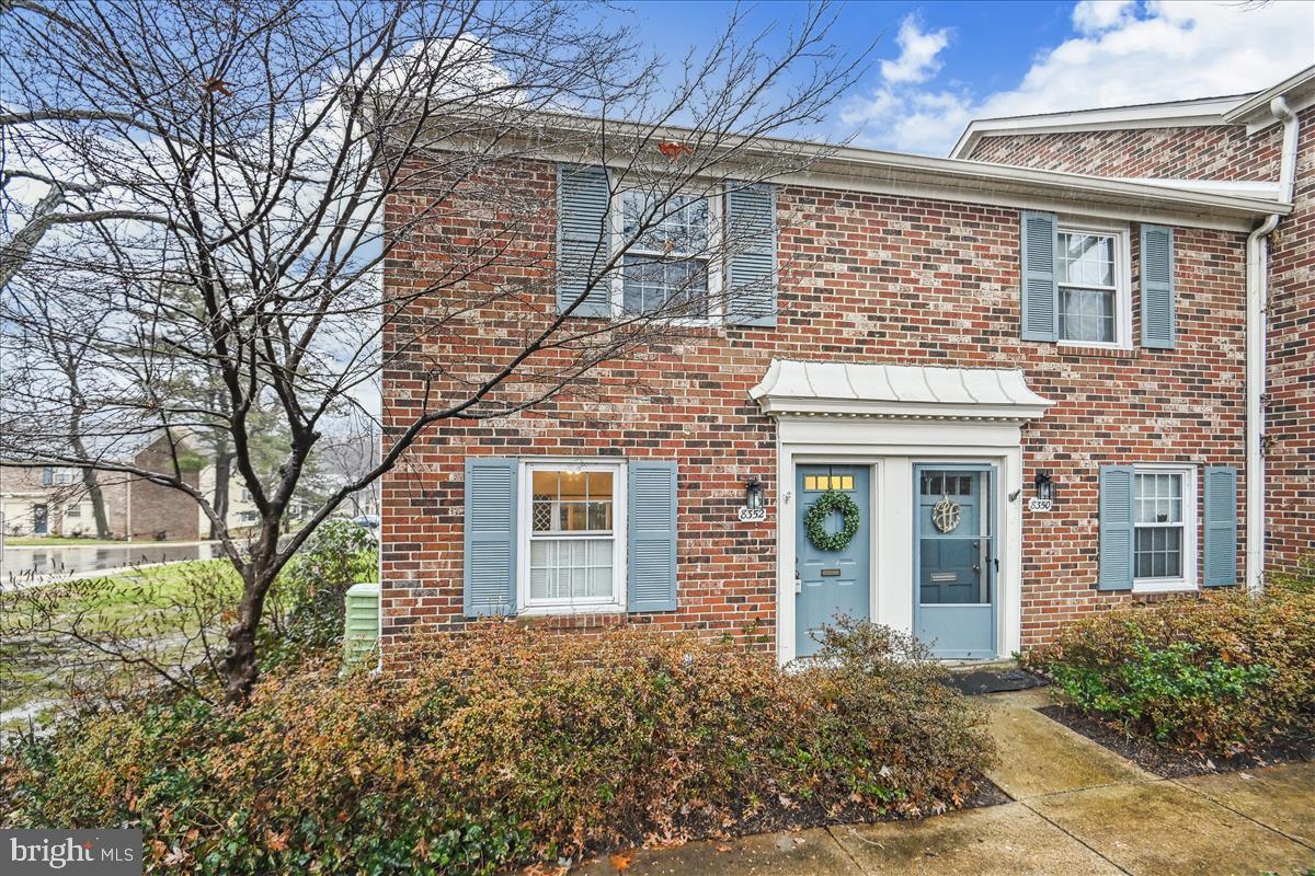 8352 Forrester Boulevard, Unit 456 Springfield, VA 22152 - Photo 18 of 18 front view of a brick house with a large windows