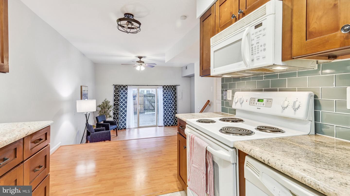 8352 Forrester Boulevard, Unit 456 Springfield, VA 22152 - Photo 3 of 18 a kitchen with a stove and a refrigerator