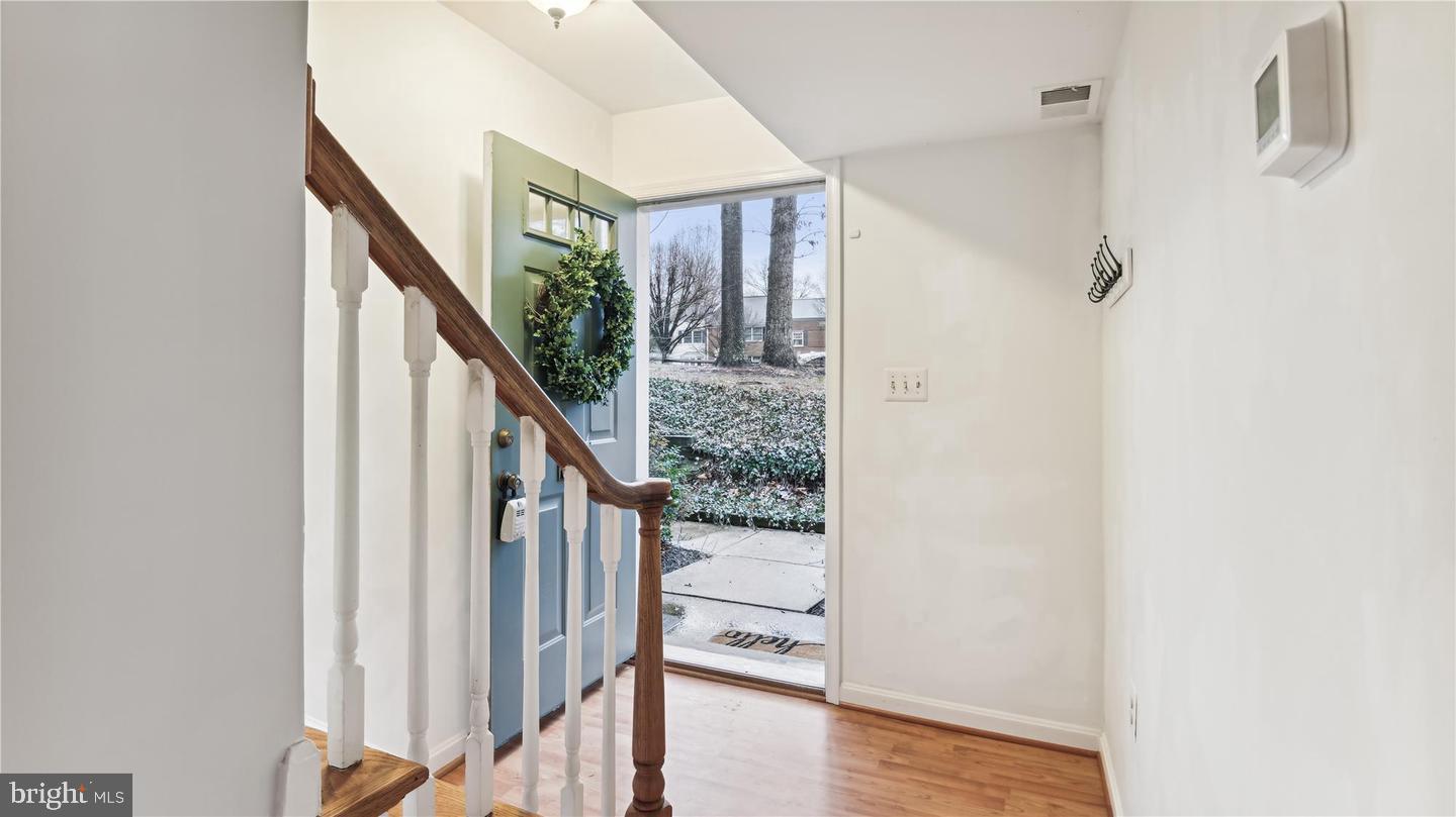 8352 Forrester Boulevard, Unit 456 Springfield, VA 22152 - Photo 7 of 18 a view of an entryway with wooden floor