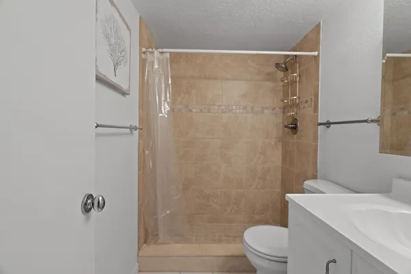 a bedroom with a bed and a table