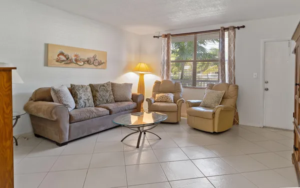 a living room with furniture and a window