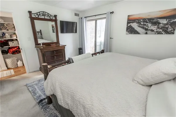 a bedroom with a bed and furniture