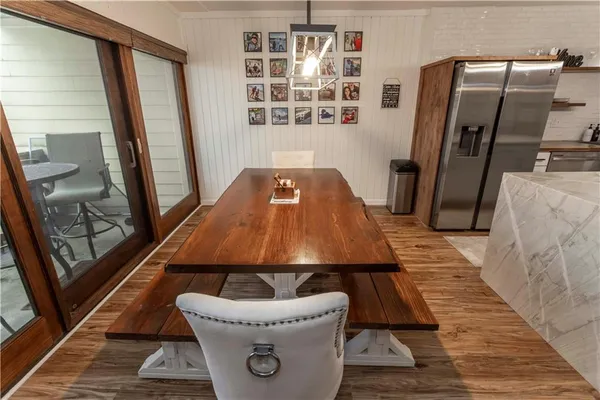 a room with pool table and windows