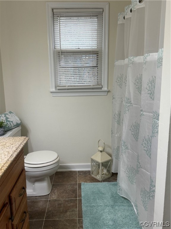 15613 Roland View Drive Chester, VA 23831 - Photo 11 of 18 a bathroom with a toilet and a sink
