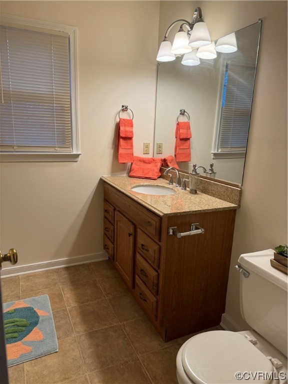 15613 Roland View Drive Chester, VA 23831 - Photo 13 of 18 a bathroom with a sink vanity mirror and toilet