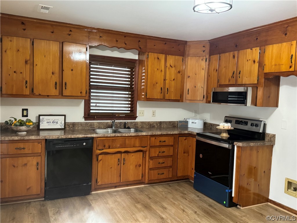 15613 Roland View Drive Chester, VA 23831 - Photo 5 of 18 a kitchen with a sink stove top oven and cabinets
