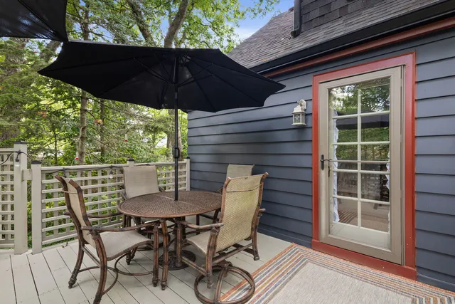 a view of an outdoor sitting area with furniture and umbrella