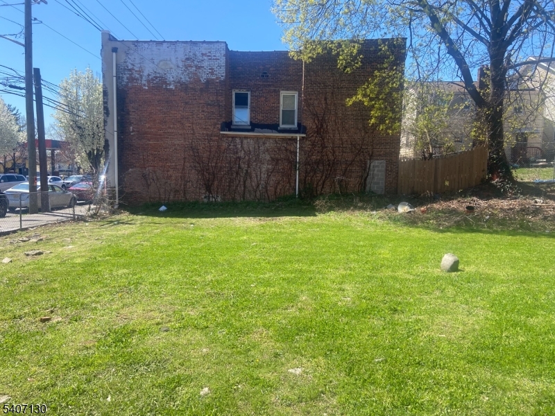 1594 Maple Avenue Hillside, NJ 07205 - Photo 4 of 7 a backyard of a house with lots of green space