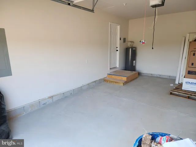 a view of room with stairs and a ceiling fan