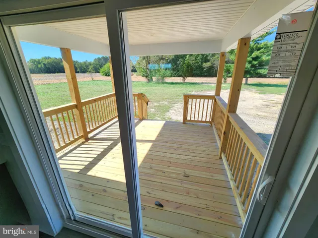 a view of balcony with furniture