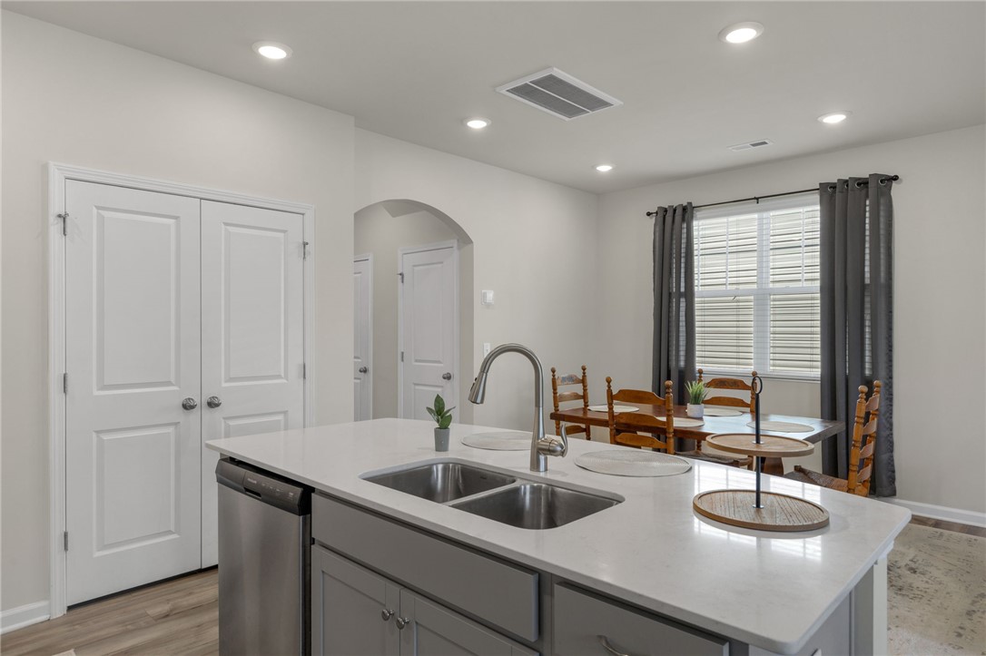 432 Bee Cv Way Pendleton, SC 29670 - Photo 12 of 39 This modern kitchen features a spacious island and an inviting dining area, perfect for daily meals.