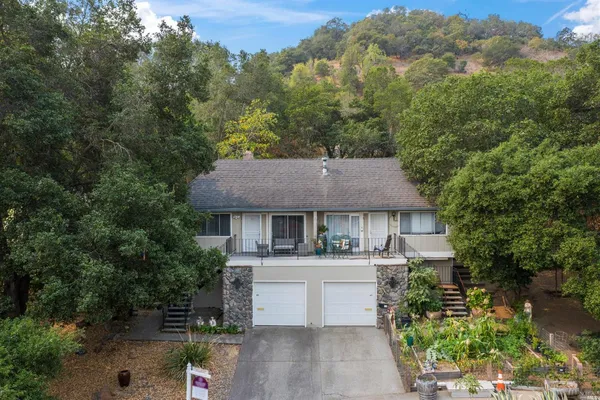 an aerial view of a house with a yard