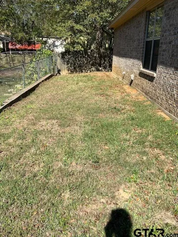 a view of a backyard of the house