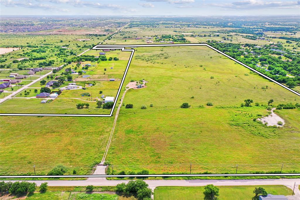 Tbd Seaborn Road Ponder, TX 76259 - Photo 4 of 12 Expansive land parcel featuring a verdant grass field and scattered trees