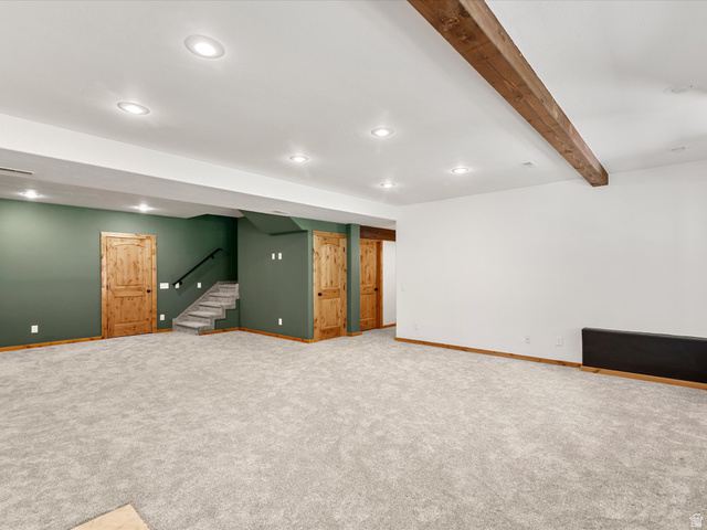 1225 Old Oregon Road Soda Springs, ID 83276 - Photo 28 of 67 Spacious room with plush carpeting, recessed lighting, and a prominent wood-finish ceiling beam