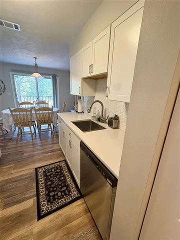 a bed room with a bed and wooden floor