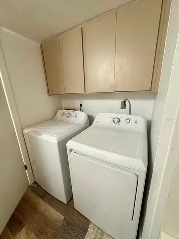 a kitchen with wooden cabinets and a stove top oven