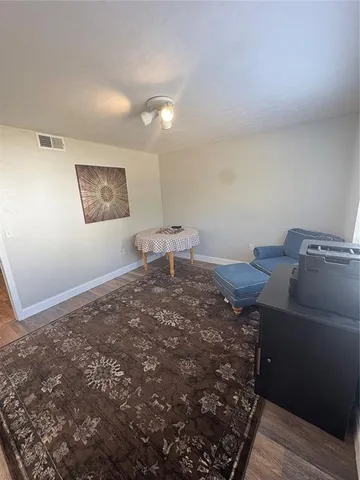 a bed sitting on a bed in a room