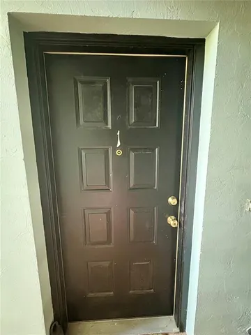 a view of a living room with furniture and a window