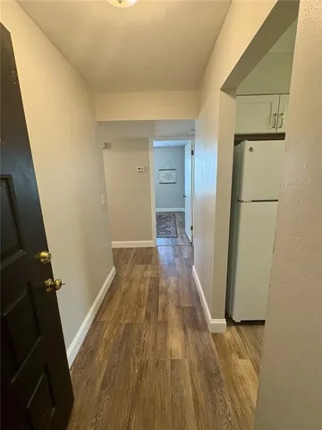 a kitchen with a sink a stove and chairs