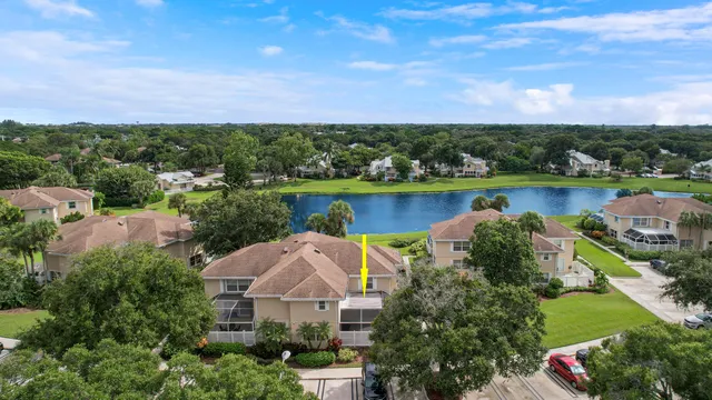 an aerial view of a house with a lake view