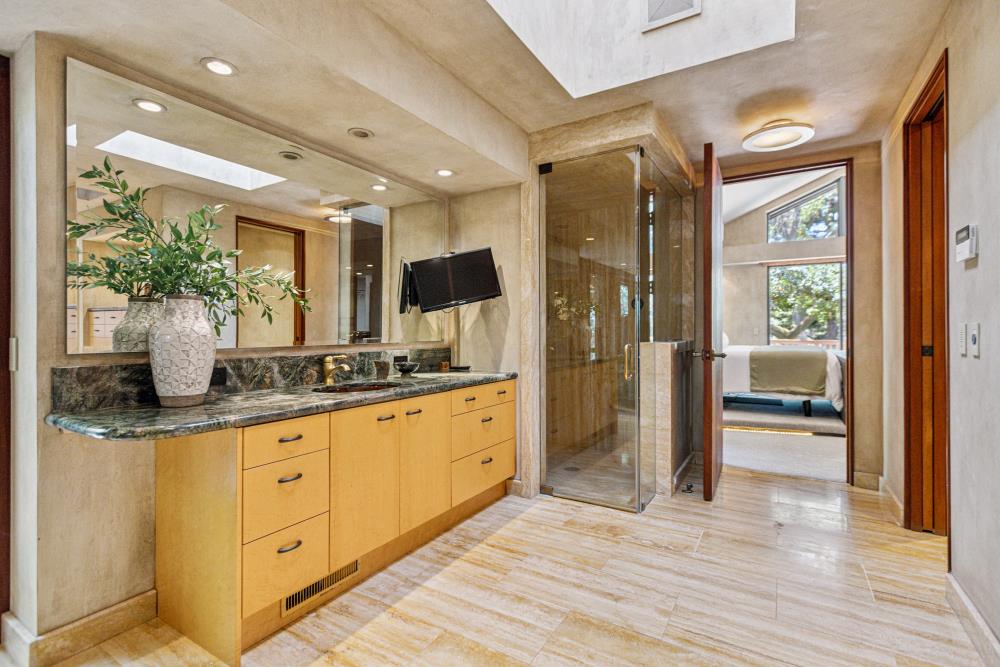 5312 Retreat Way Carmichael, CA 95608 - Photo 38 of 92 a bathroom with a granite countertop sink a mirror and a shower