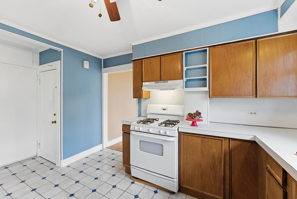 63 Webber Street Springfield, MA 01108 - Photo 11 of 40 a kitchen with a sink cabinets and appliances