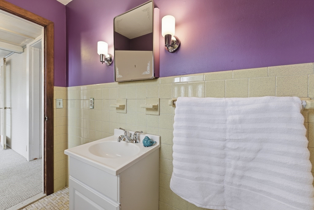 63 Webber Street Springfield, MA 01108 - Photo 15 of 40 a bathroom with a sink and a mirror