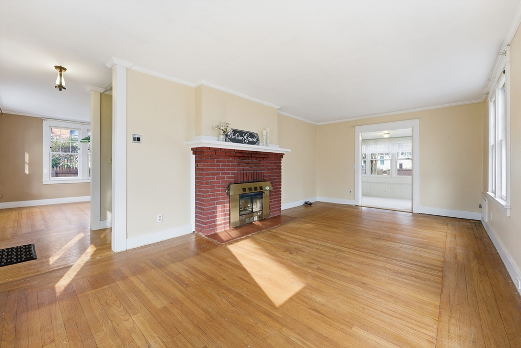 63 Webber Street Springfield, MA 01108 - Photo 21 of 40 a view of empty room with wooden floor and fireplace