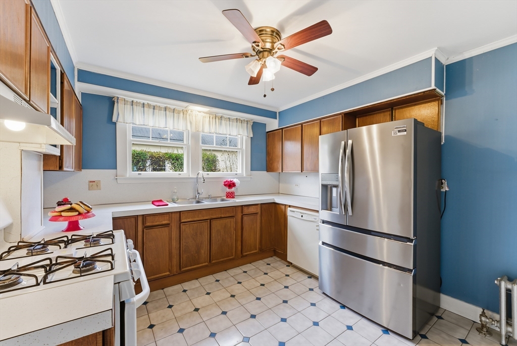 63 Webber Street Springfield, MA 01108 - Photo 8 of 40 a kitchen with stainless steel appliances a stove a sink and a refrigerator